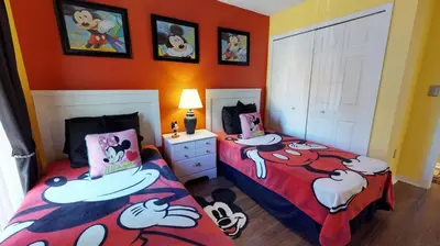 a bedroom with two beds with hello kitty sheets at Magari at Emerald Island in Kissimmee