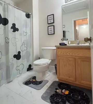 a bathroom with a toilet and a shower and a sink at Asteria at Emerald Island in Kissimmee