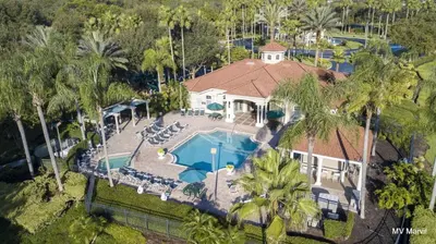 an aerial view of a house with a swimming pool at Asteria at Emerald Island in Kissimmee