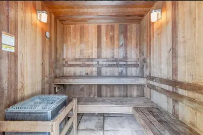 an empty sauna with a mattress in a wooden room at Apartamento 2 Suítes no Cane Island Resort in Kissimmee