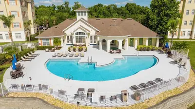 an aerial view of a house with a swimming pool at Apartamento 2 Suítes no Cane Island Resort in Kissimmee