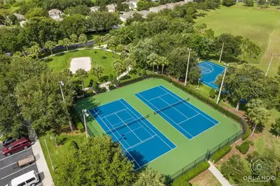 an overhead view of a tennis court at Free Arcade! All Themed! South Facing Pool & Spa! in Orlando