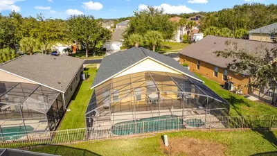 an image of a house with a bird cage at Emerald Island Disney Villa with Pool & Spa in Kissimmee