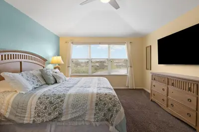 a bedroom with a bed and a flat screen tv at Windsor Hills Fun 6BR Villa Pool Spa By Disney in Orlando