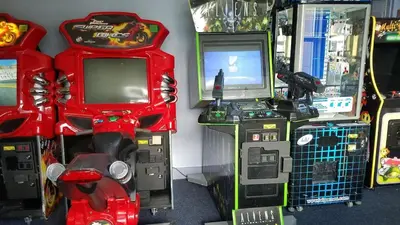 a group of video game machines sitting next to each other at Blue Heron Beach Resort 1-809 in Orlando