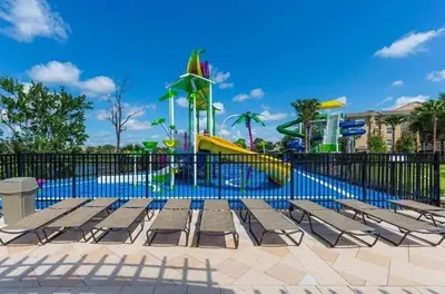 a park with a playground with slides and benches at Themed Windsor Hills 6BR Private Pool Gameroom in Orlando