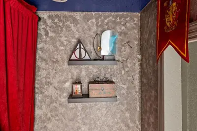 a room with two shelves and a red curtain at 6 BR Home, Themed Rooms, Private Pool, Windsor Hills by Blue Sky Villas in Orlando