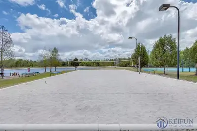 a volleyball court in a park with a volleyball net at Condo 4Q Seven Dwarfs Resort - Perto da Disney in Kissimmee