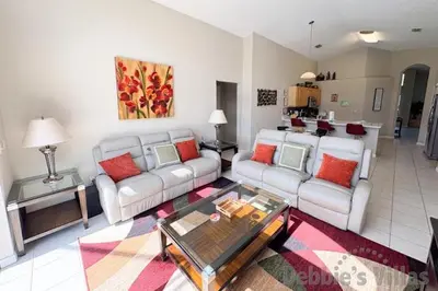 a living room with two couches and a coffee table at Seasons Kissimmee in Kissimmee