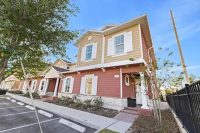 a row of houses on a street at 5 Suites Sleeps 14 Lion King Mickey Theme in Orlando