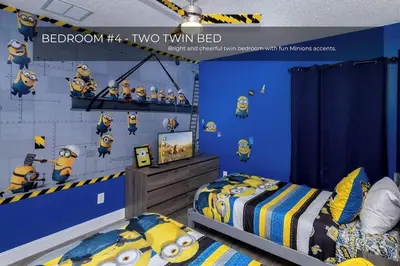 a bedroom with two twin beds and a blue wall at 5BRDisney Villa Pool,Game Room & Resort Access in Kissimmee