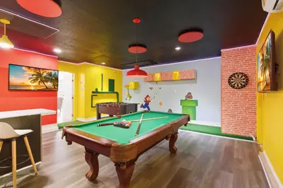 a billiard room with a pool table in it at Disney Heated Pool & Arcade Home 15 mins to Park in Kissimmee