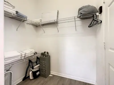 a room with white walls and shelves with towels at Holiday Home Familien-Pool-Rückzug nur 2-5 Meilen von Disney entfernt by Interhome in Kissimmee