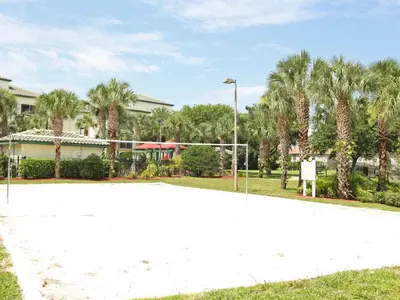 a volleyball court in a park with palm trees at Apartment Orlando Condo in der Nähe von Disney- Schläft 8 by Interhome in Kissimmee