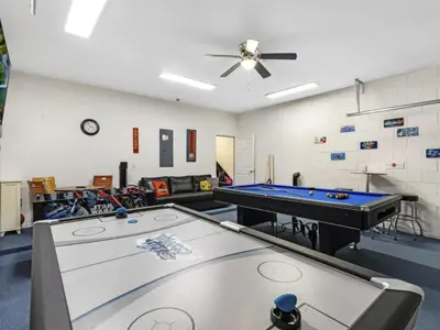 a living room with a ping pong table in it at Holiday Home Ferienvilla Magical Memories by Interhome in Kissimmee