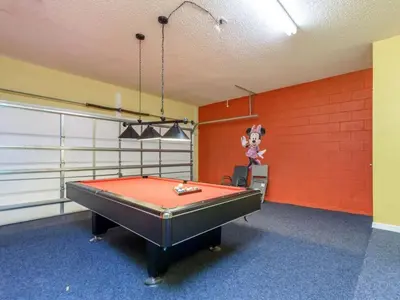 a ping pong table in a room with a wall at Holiday Home 2696LIC by Interhome in Kissimmee