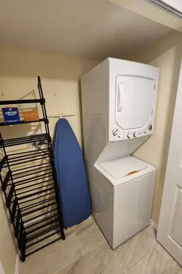 a small room with a refrigerator and a tv at Apartment 3-Bett-Eigentumswohnung Familienspaß in der Nähe von Disney by Interhome in Kissimmee