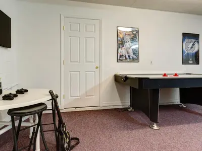 a room with a ping pong table and a pool table at Holiday Home Luxuriöse 4-Bett-Villa in Disney by Interhome in Kissimmee