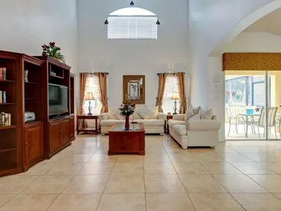 a living room with a couch and a tv at Holiday Home Luxuriöse 4-Bett-Villa in Disney by Interhome in Kissimmee