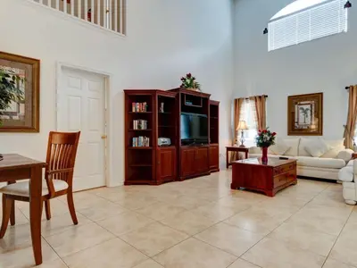 a living room with a couch and a tv at Holiday Home Luxuriöse 4-Bett-Villa in Disney by Interhome in Kissimmee