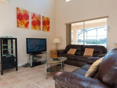 a living room with a couch and a television at Holiday Home Villa Glenbrook Resort by Interhome in Orlando