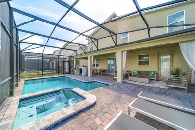 a house with a swimming pool with a glass ceiling at Storey Lake Resort 9Q c/ Piscina & Game Room in Kissimmee