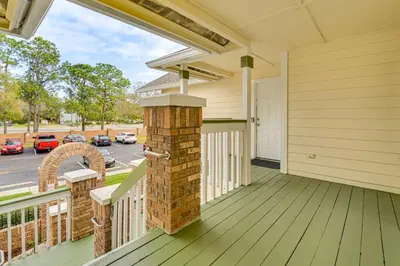 a porch of a home with a brick fireplace at Family Theme Park Hub with Pool in Kissimmee in Kissimmee