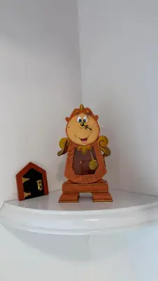 a toy monkey is on top of a shelf at Disney Princess and Heroes Apartment Accessible in Orlando