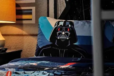a bed with a pillow with a black gorilla on it at 4BR Family Villa Pool Game Room Near Disney in Orlando