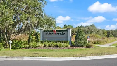 a sign for a thousand voice on the side of a road at Comfort & Charm in Central Florida in Sanford
