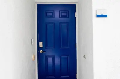 a blue door in a hallway of a building at Lake view Near Disney Resort w Lazy River 108 in Kissimmee