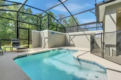 a swimming pool in a house with a glass ceiling at Luxury, Luxury, Luxury Pool Home! townhouse in Kissimmee