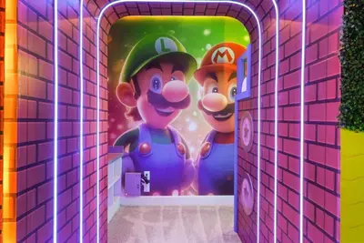 a mural of mario and mario characters in a bathroom at Kids Will Love! New Premium Theater & Theme Rooms villa in Orlando