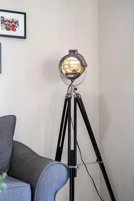 a light on a tripod next to a couch at Relaxing Resort Townhome Close to Disney in Kissimmee