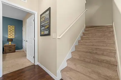 a staircase in a home with a stair case at Relaxing Resort Townhome Close to Disney in Kissimmee
