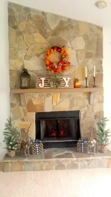 a stone fireplace with a wreath on top of it at 4 Bedroom Private Pool House - 5 Mi to Convention Center & 7 Mi to Disney in Orlando