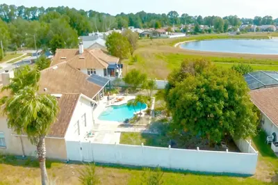 an aerial view of a house with a swimming pool at 4 Bedroom Private Pool House - 5 Mi to Convention Center & 7 Mi to Disney in Orlando
