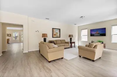 a living room with two couches and two chairs at Casa 6Q Bella Vida Resort – Perto Disney in Kissimmee