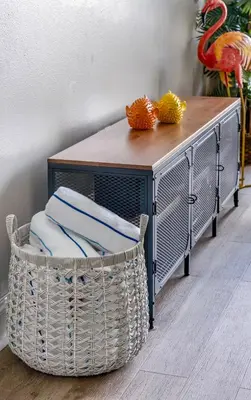 a table with a basket and a table with towels at Blue Heron Resort in Orlando