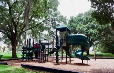 a playground with a slide in a park at Savvy 4Bed Stay Near Orlando Attractions in Kissimmee