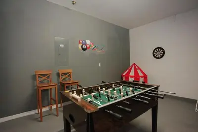 a game room with a foosball table at Spacious Home - Veranda Palms w Heated Pool & BBQ in Kissimmee