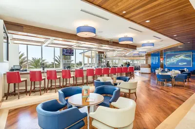 a restaurant with tables and chairs and a bar at Blush Breeze Cottage Near Disney With Private Pool & Margaritaville Resort And Island H20 Waterpark Access - 2940Sr in Orlando