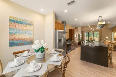 a kitchen and dining room with a table and chairs at Magic Villa - 4 En-Suite & BBQ Grill in Orlando