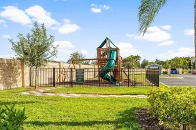 a playground with a slide in a park at Townhome 4Q no West Lucaya — 15min Disney in Kissimmee