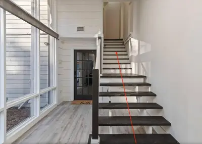 a red line on the stairs of a house at Romantic Getaway Cabin with Jacuzzi in Kissimmee