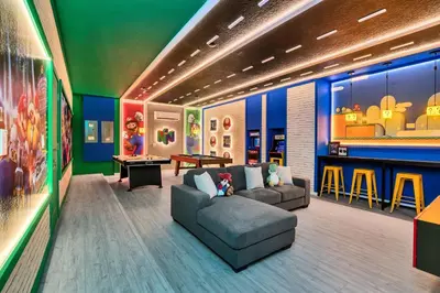 a living room with a couch and a table at Luxurious 15-Bedroom Villa With Pool & Games Room in Kissimmee