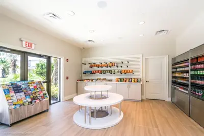 a room with a table and a book shelf at Ev1810 - Solara Galaxy Villa in Orlando