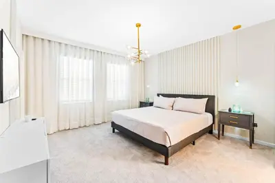 a bedroom with a bed and a large window at Ev2440 - Orlando Luxe Retreat in Kissimmee