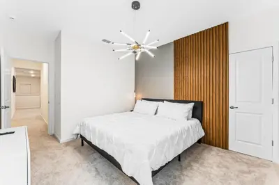 a bedroom with a bed and a ceiling fan at Ev2440 - Orlando Luxe Retreat in Kissimmee
