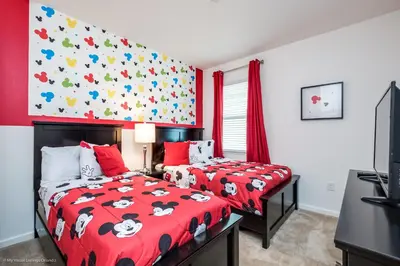 a bedroom with two twin beds with red comforter at Ev2619 - Sonoma Retreat in Kissimmee